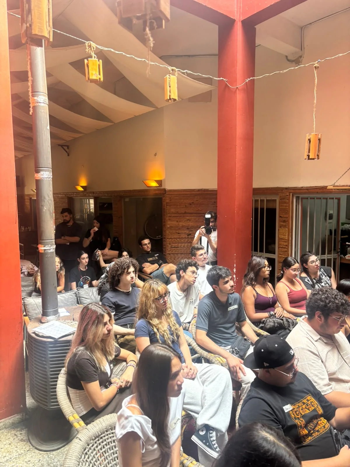 Young people seated together at a community gathering